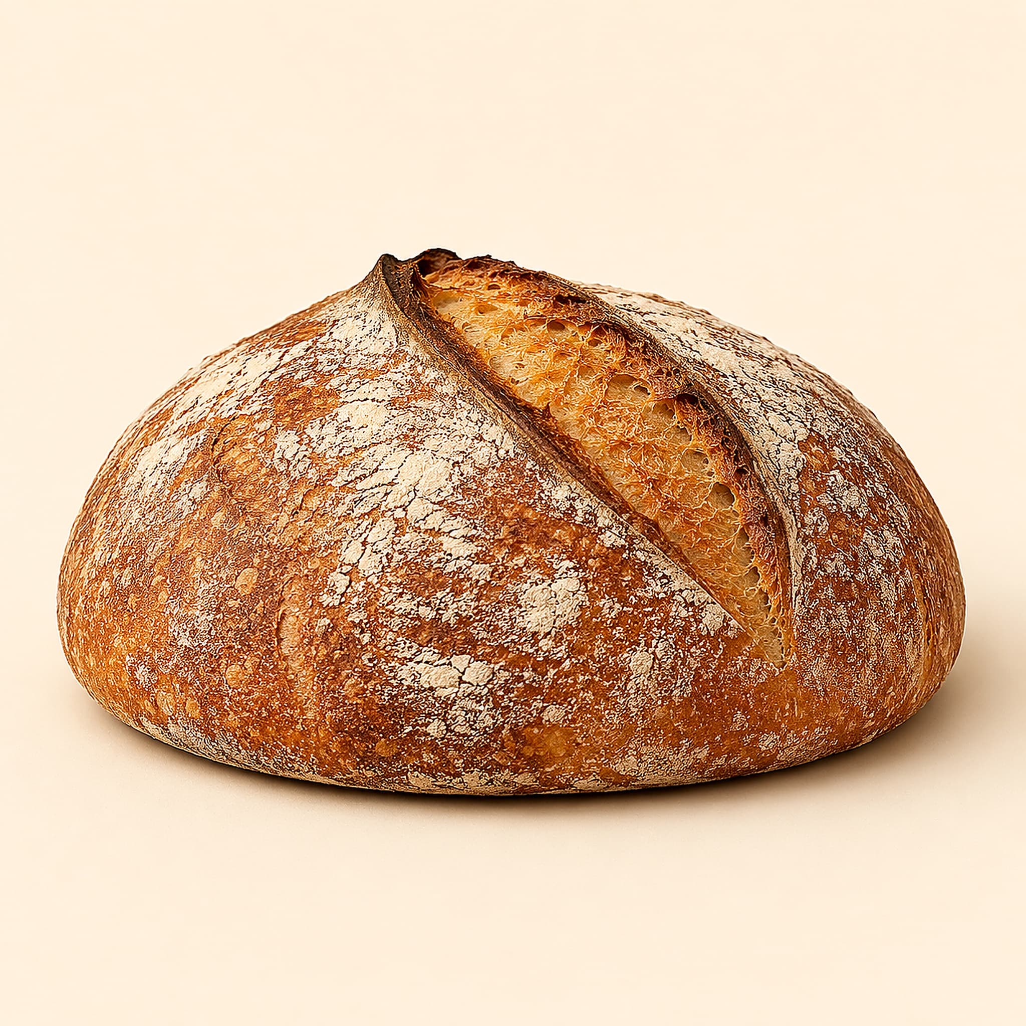A golden, scored sourdough loaf
